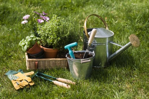 Professional gardener using protective equipment during garden care